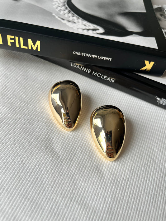 Nerūdijančio plieno, aukso spalvos, veido formos auskarai.